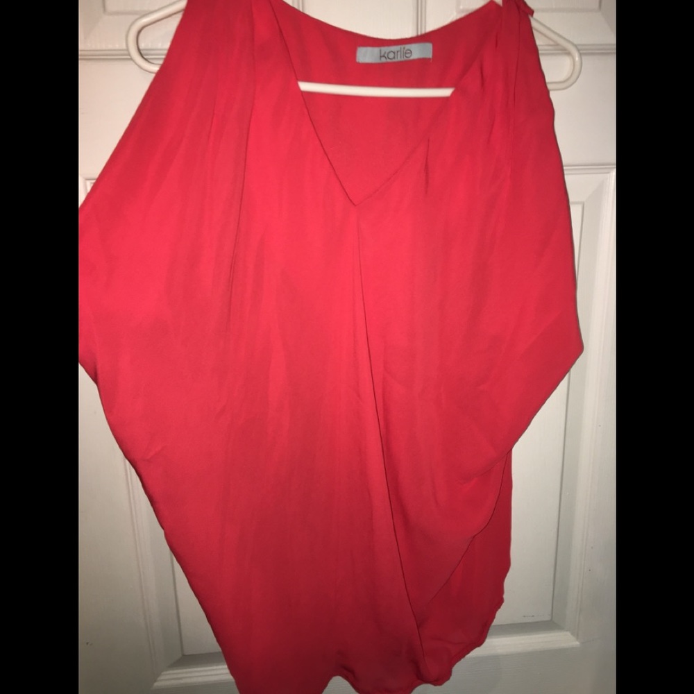Dark coral colored top.